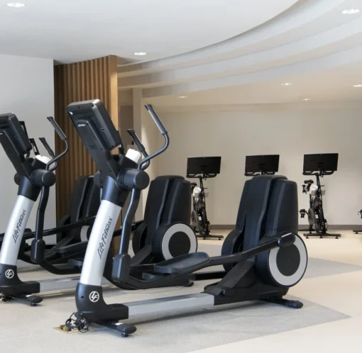 Modern gym at Golf Resort & SPA The Westin Stonebriar pa with ellipticals and bikes, all in a bright, clean space.